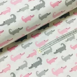 Tela de algodón de cocodrilo rosa y gris.