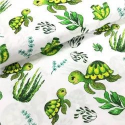 Tela de algodón impresa con tortugas y plantas de costura verde.
Nikita lobo