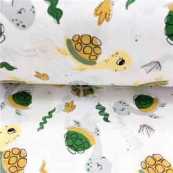 Cotton fabric printed with green seam turtles and plants | Wolf Fabrics